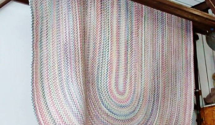 Dirty braided rug, color faded