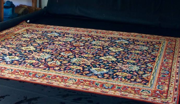 Stained karastan rug